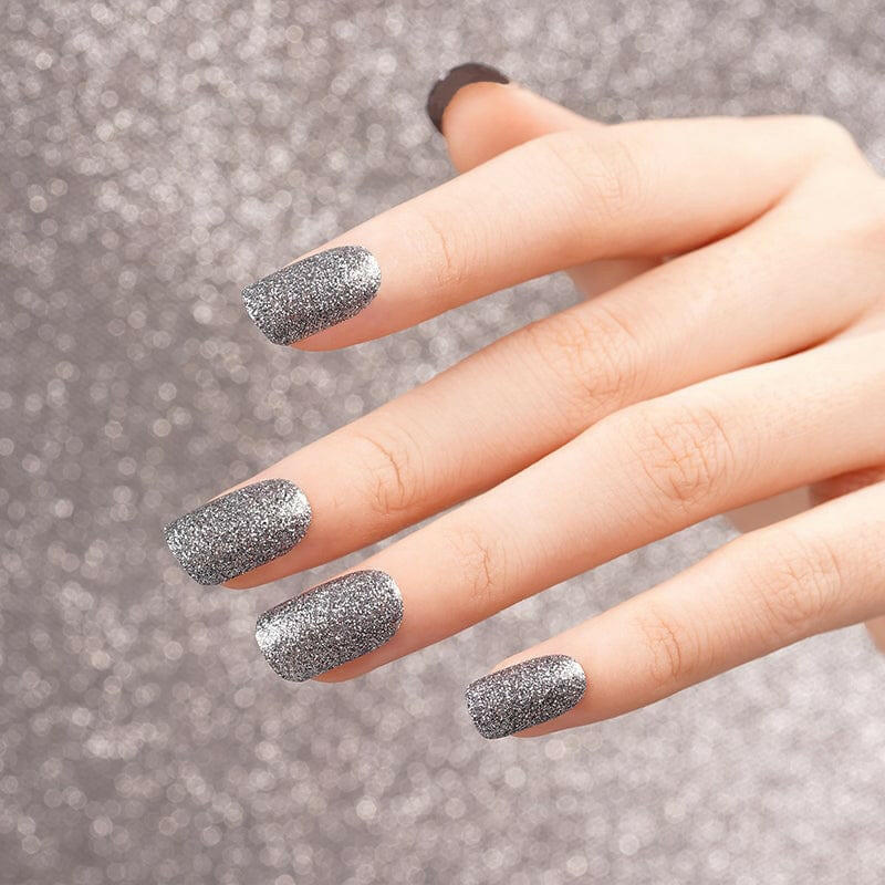 Silver chrome nail wraps with high shine glitter finish on hand