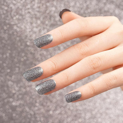 Silver chrome nail wraps with high shine glitter finish on hand
