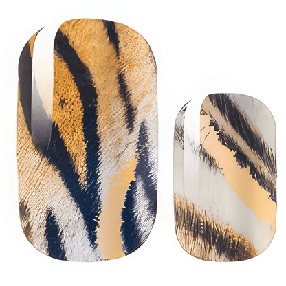 Close-up tiger stripe nail wraps showing orange and black animal print pattern detail