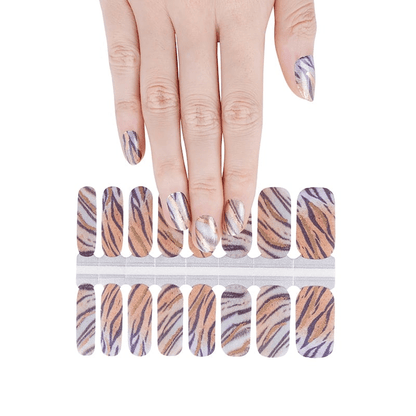 Metallic purple tiger stripe nail wraps sheet with hand showing applied animal print nails