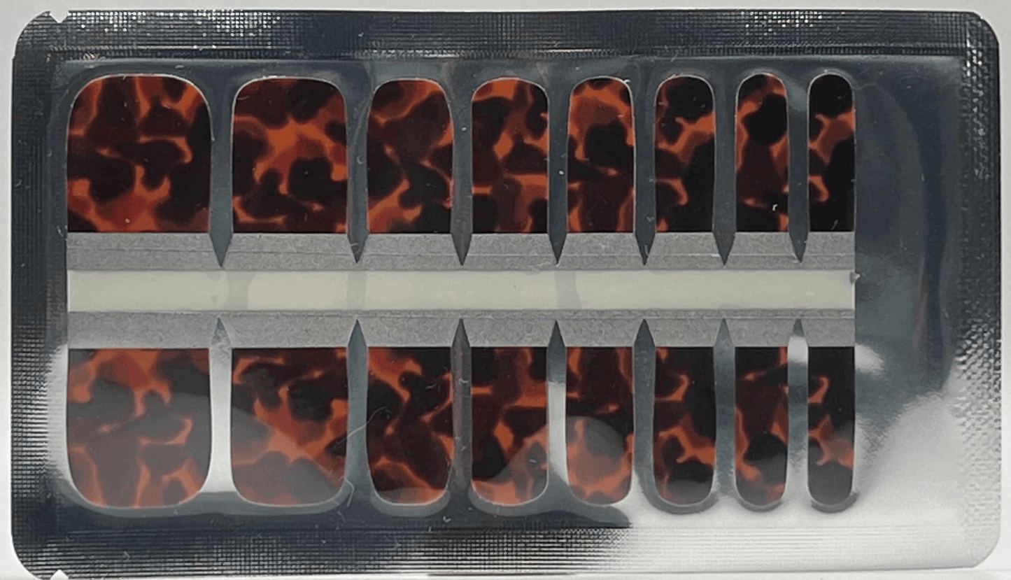 Tortoiseshell pedicure nail wraps in packaging showing brown animal print pattern