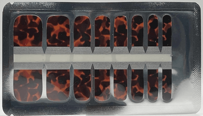 Tortoiseshell pedicure nail wraps in packaging showing brown animal print pattern