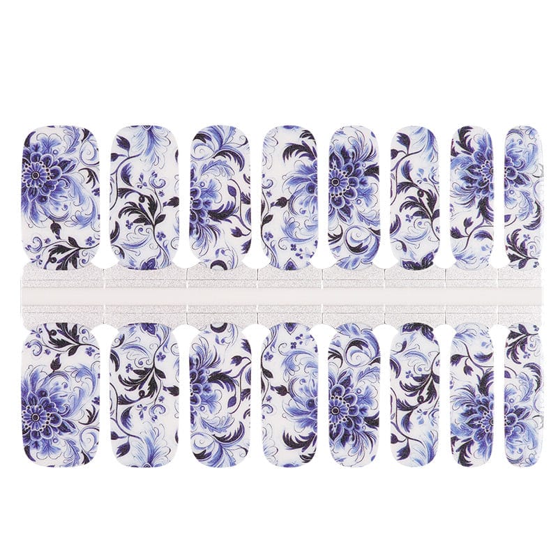 Blue and white porcelain-style nail wrap sheets with delicate floral swirl patterns