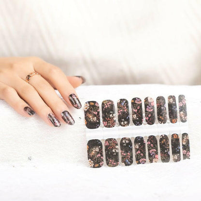 Gothic floral nail wrap sheets with dark botanical patterns and pink accents on black base