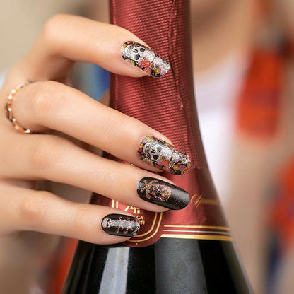 Sugar skull nail art wraps with colourful flowers on black background manicure