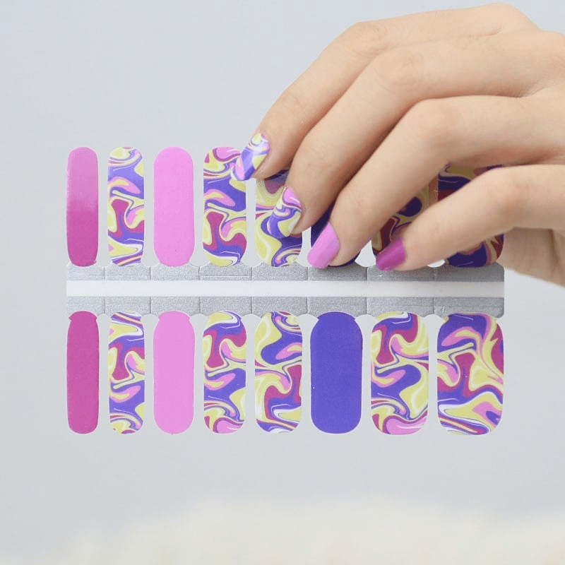 Non-UV nail wraps with retro swirl design displayed on hand showing application