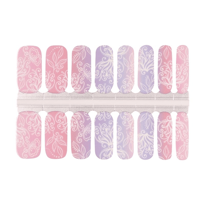 Pink and lavender floral nail wraps sheet displaying botanical lace patterns for at-home manicure