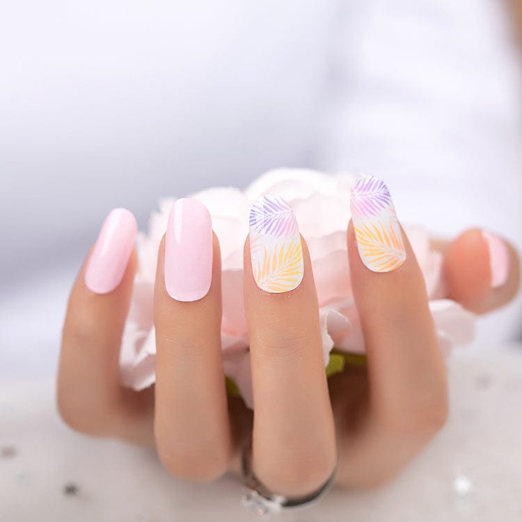 Pink manicure featuring tropical fern nail art with glossy coral leaf patterns