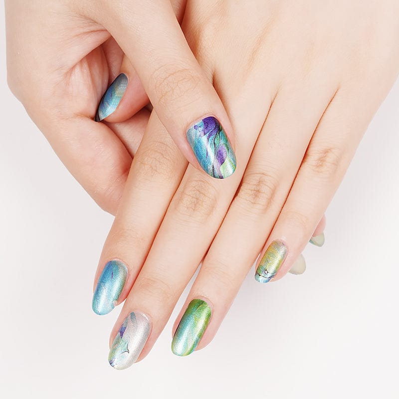Hand displaying blue green marble nail wraps with turquoise water pattern design