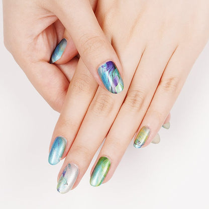 Hand displaying blue green marble nail wraps with turquoise water pattern design