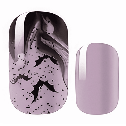 Purple nail wraps with black bat pattern design showing Halloween themed nail art