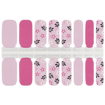 Pink floral nail wraps with delicate flower patterns and botanical designs for at-home manicures