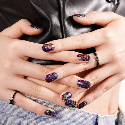 Hands wearing prismatic mosaic nail wraps in blue purple holographic finish