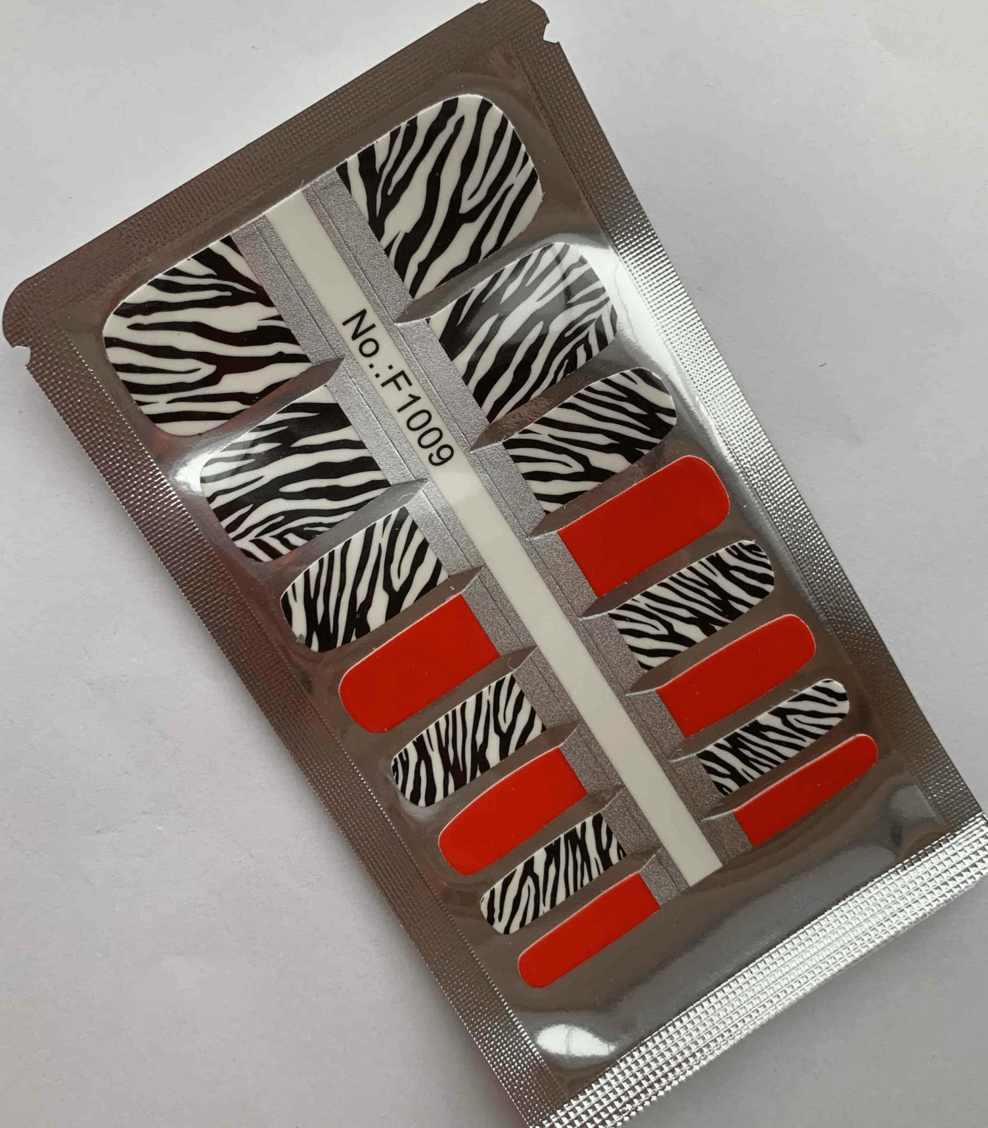Zebra safari pedicure nail wraps sheet with black white stripes and red accents