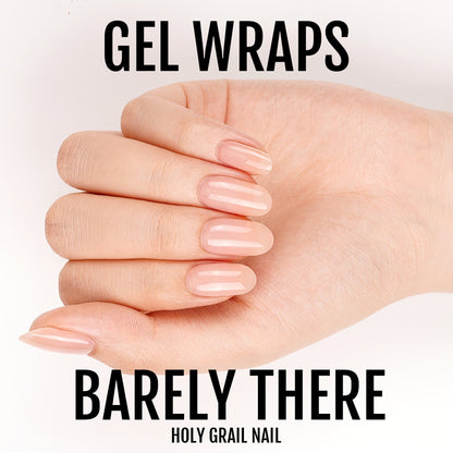 Barely there nude gel nail wraps on hand with natural pink tones