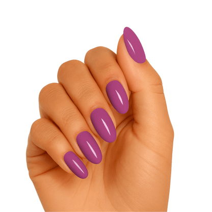 Glossy berry purple gel nails on hand showing semi-cured gel manicure finish