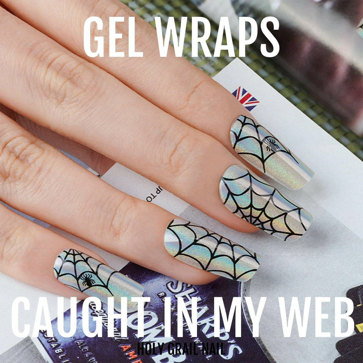 Holographic spider web gel nail wraps on hand showing gothic Halloween nail art design