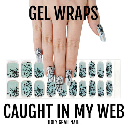 Spider web pattern gel nail wraps sheet showing black holographic gothic Halloween manicure designs