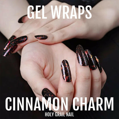 Black burgundy holographic gel nail wraps on hand showing glossy metallic finish