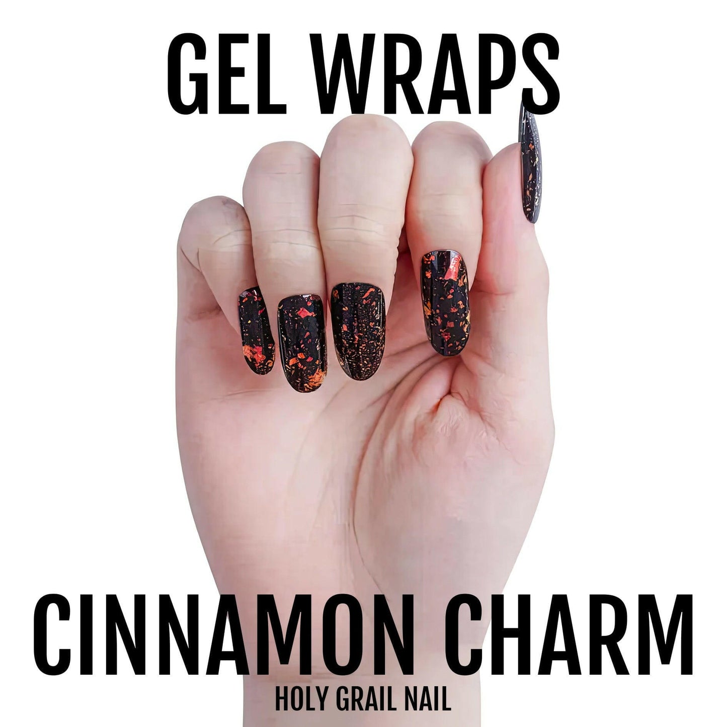 Hand wearing black gel nail wraps with orange holographic sparkle finish manicure