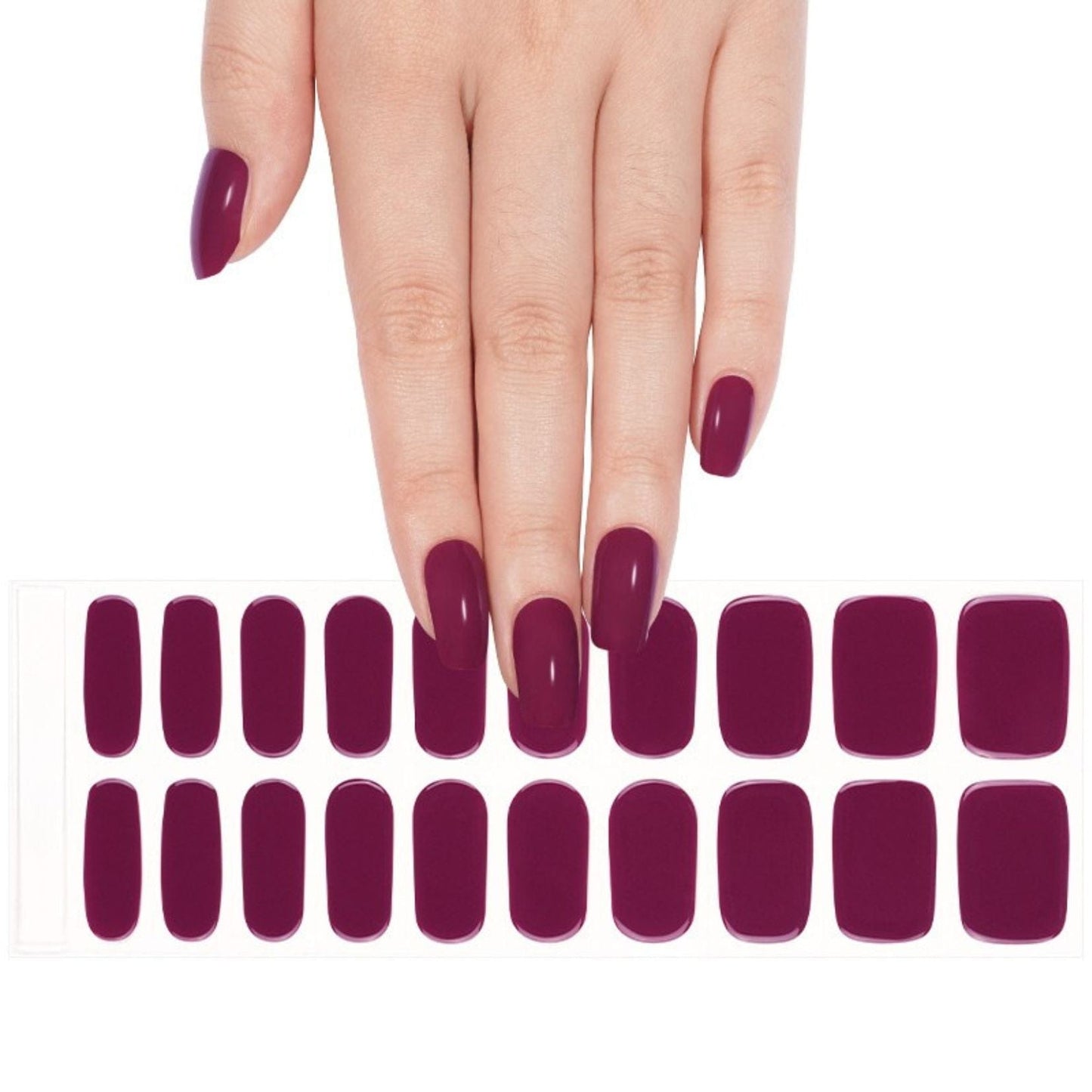Deep burgundy gel nail wraps on hand with matching nail wraps sheet for at-home manicure