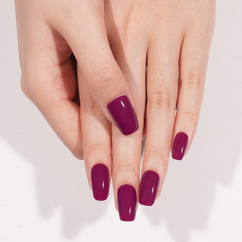 Burgundy gel nail wraps on fingertips showing deep wine colour and glossy shine