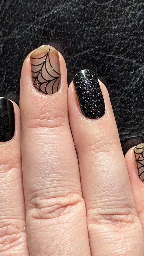 Gothic Halloween gel nail wraps featuring black glitter and cobweb spider patterns