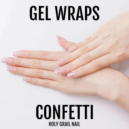 Gel nail wraps with pink confetti pattern displayed on fingers for DIY manicure