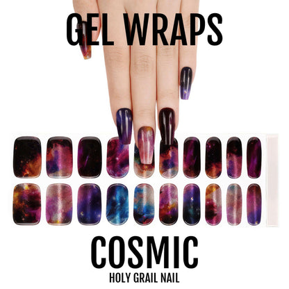 Hand model wearing cosmic galaxy gel wraps with twenty nail wraps display sheet