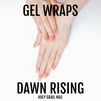 Orange gradient gel nail wraps on hands showing Dawn Rising semi-cured manicure design