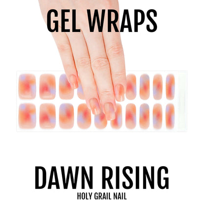 Dawn Rising gel nail wraps with orange gradient ombre effect displayed on hand
