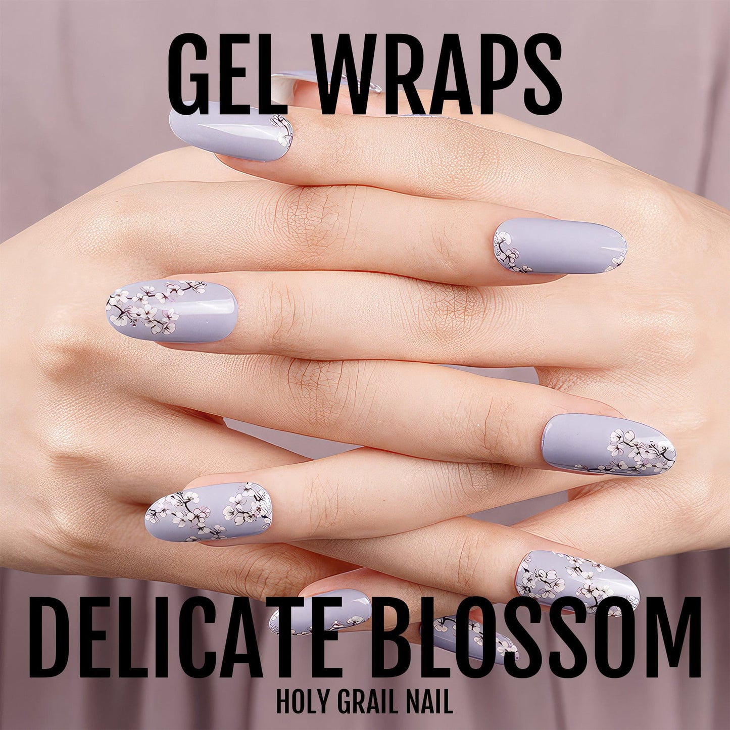 Purple gel nail wraps with white blossom pattern on hands displaying spring floral nail art