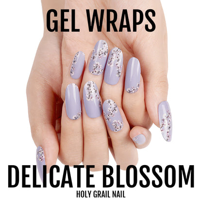 Lavender gel nail wraps with delicate floral pattern on hand showing manicured nails