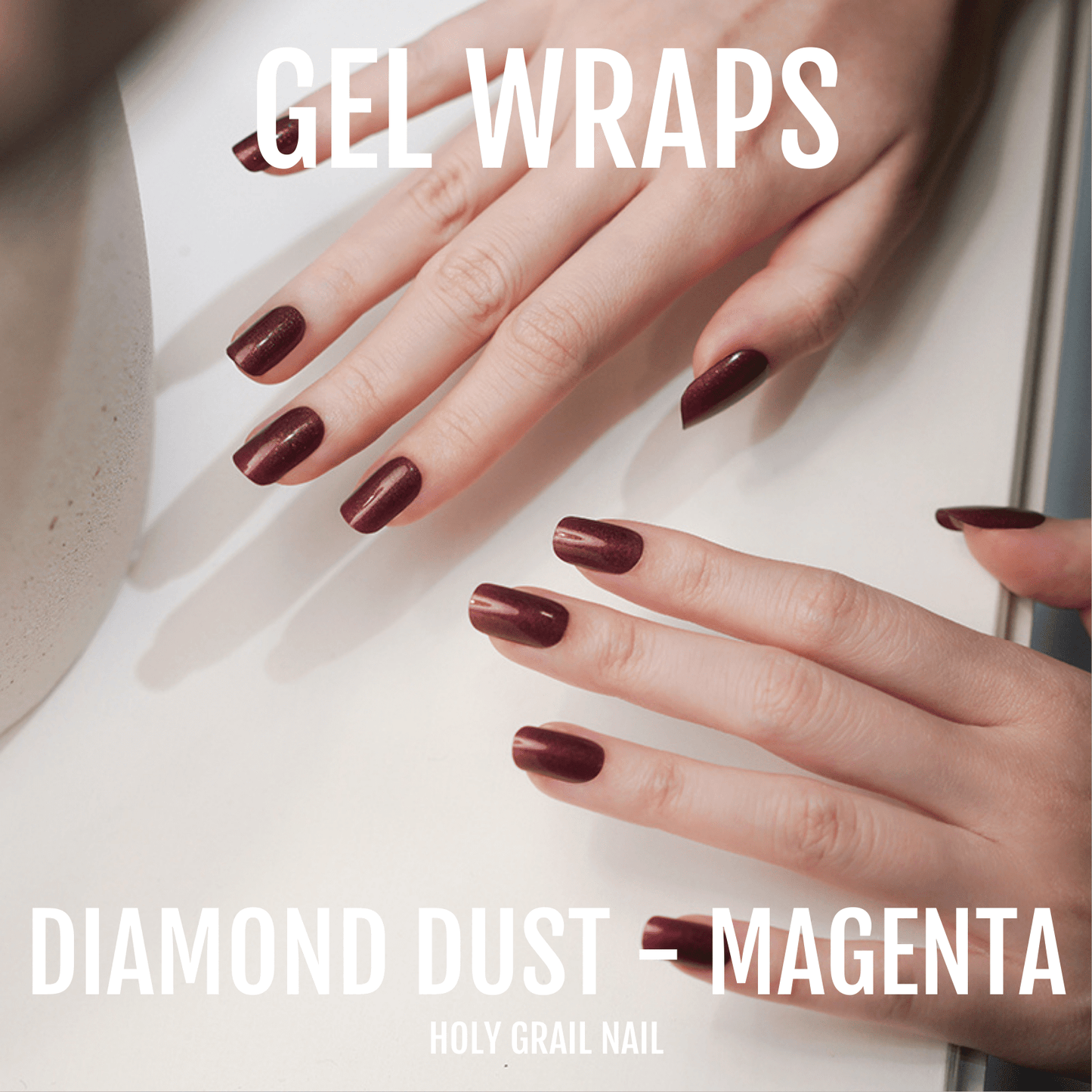 Deep magenta gel wraps on hands with diamond dust shimmer finish nail art