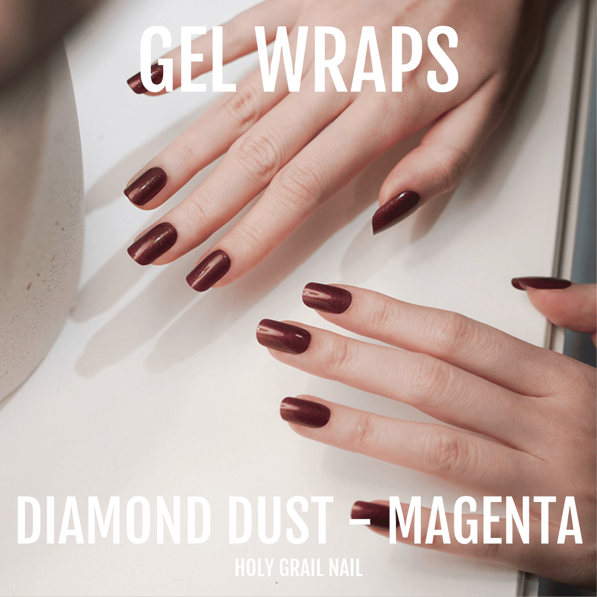 Deep magenta gel wraps on hands with diamond dust shimmer finish nail art