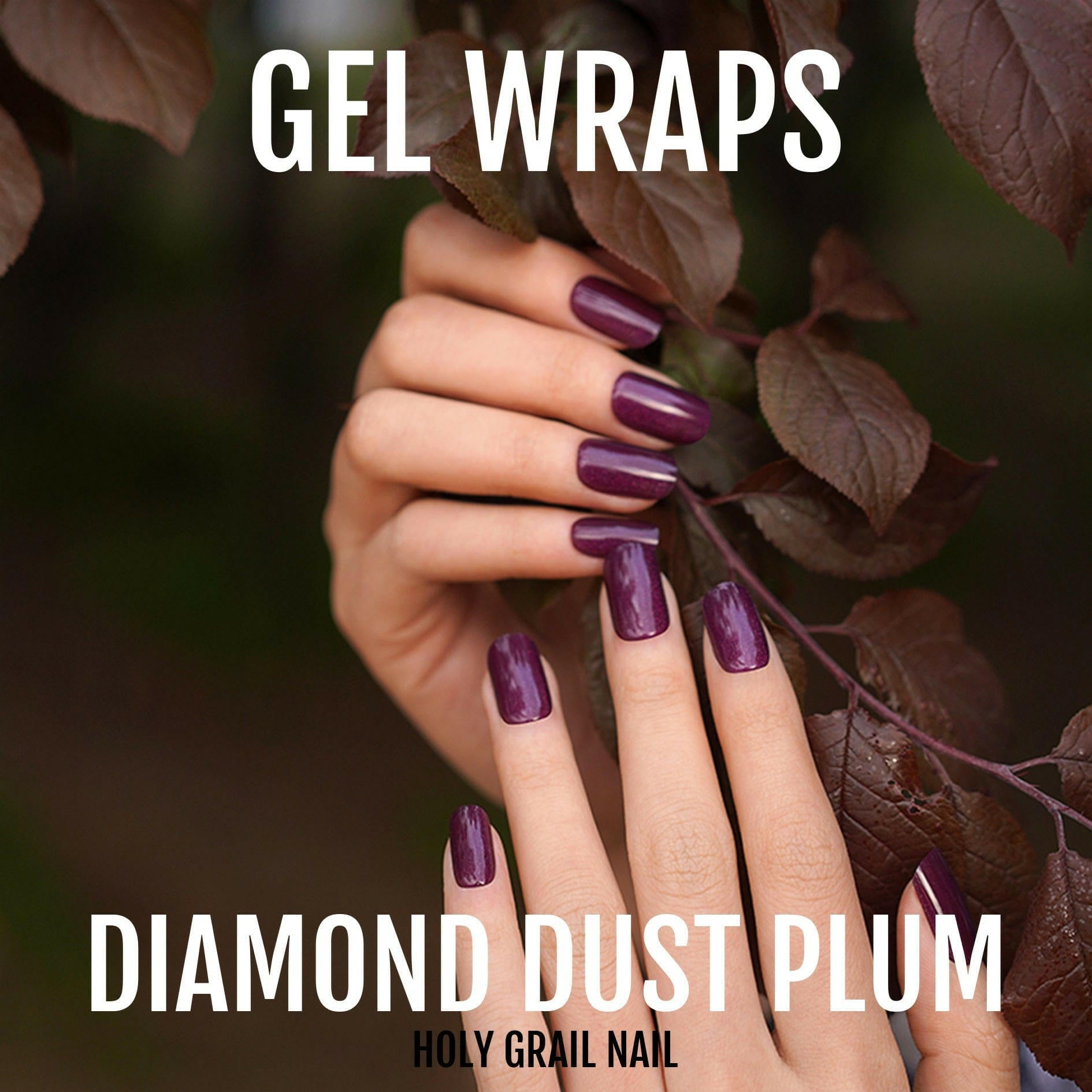 Purple plum gel nail wraps with diamond dust glitter finish on hand with autumn leaves