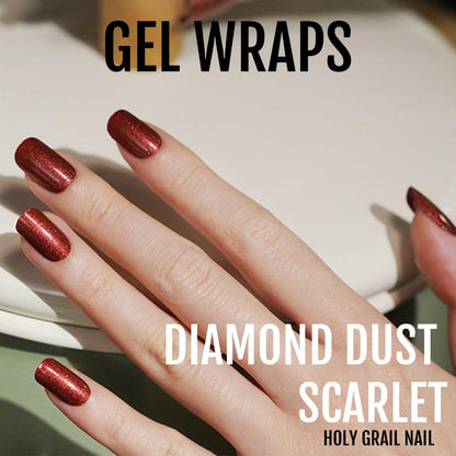 Scarlet red glittery gel nail wraps on hand showing diamond dust sparkle effect