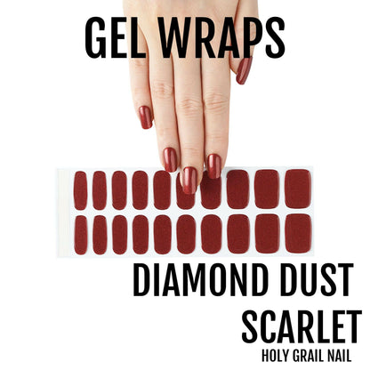 Deep red scarlet gel nail wraps with diamond dust glitter finish and hand model