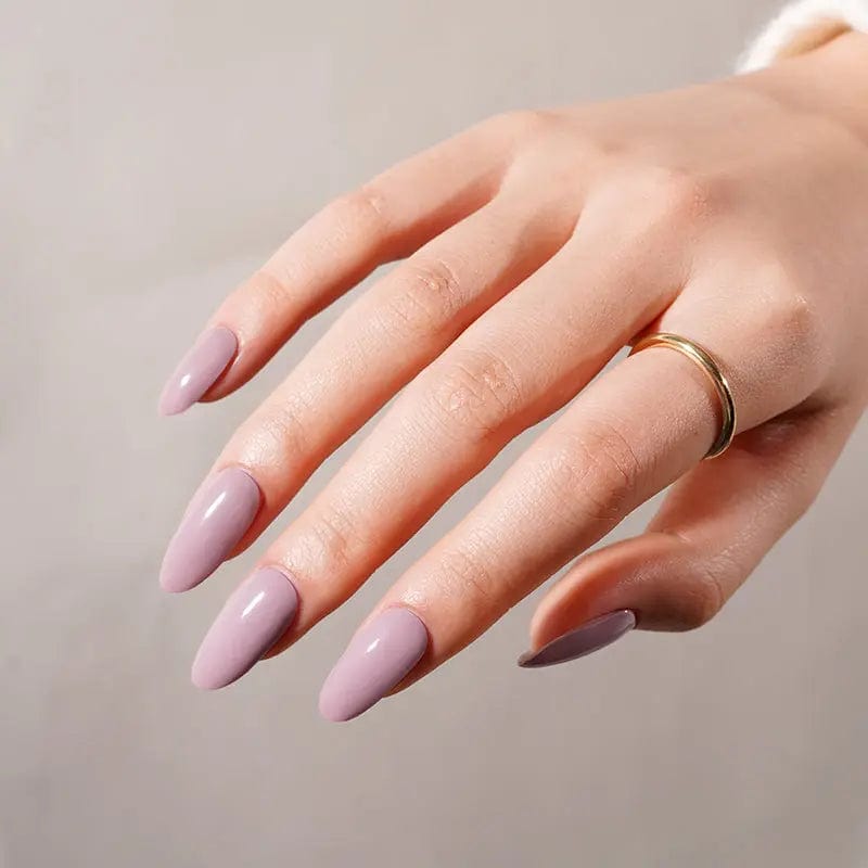 Lilac gel nail wraps on hand with glossy mauve finish for professional manicure