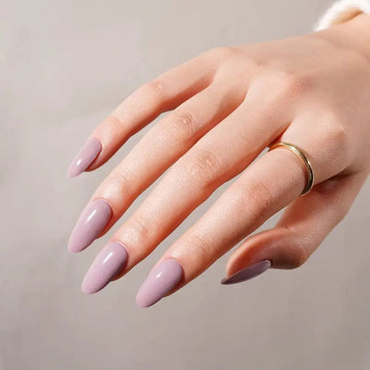 Lilac gel nail wraps on hand with glossy mauve finish for professional manicure