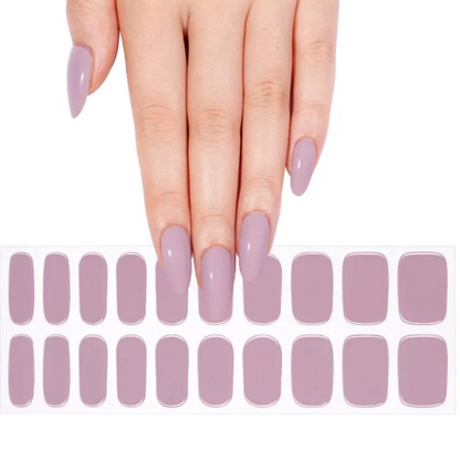 Dusty mauve gel nail wraps displayed with hand showing glossy lilac nail art manicure