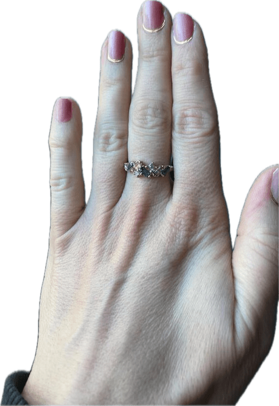 Hand wearing subtle pink gel nail wraps with glossy gradient ombré finish