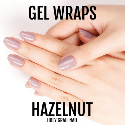 Glossy hazelnut mauve gel nail wraps on hands showing neutral nude manicure finish