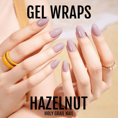 Mauve hazelnut gel wraps on hands displaying glossy neutral nail art manicure