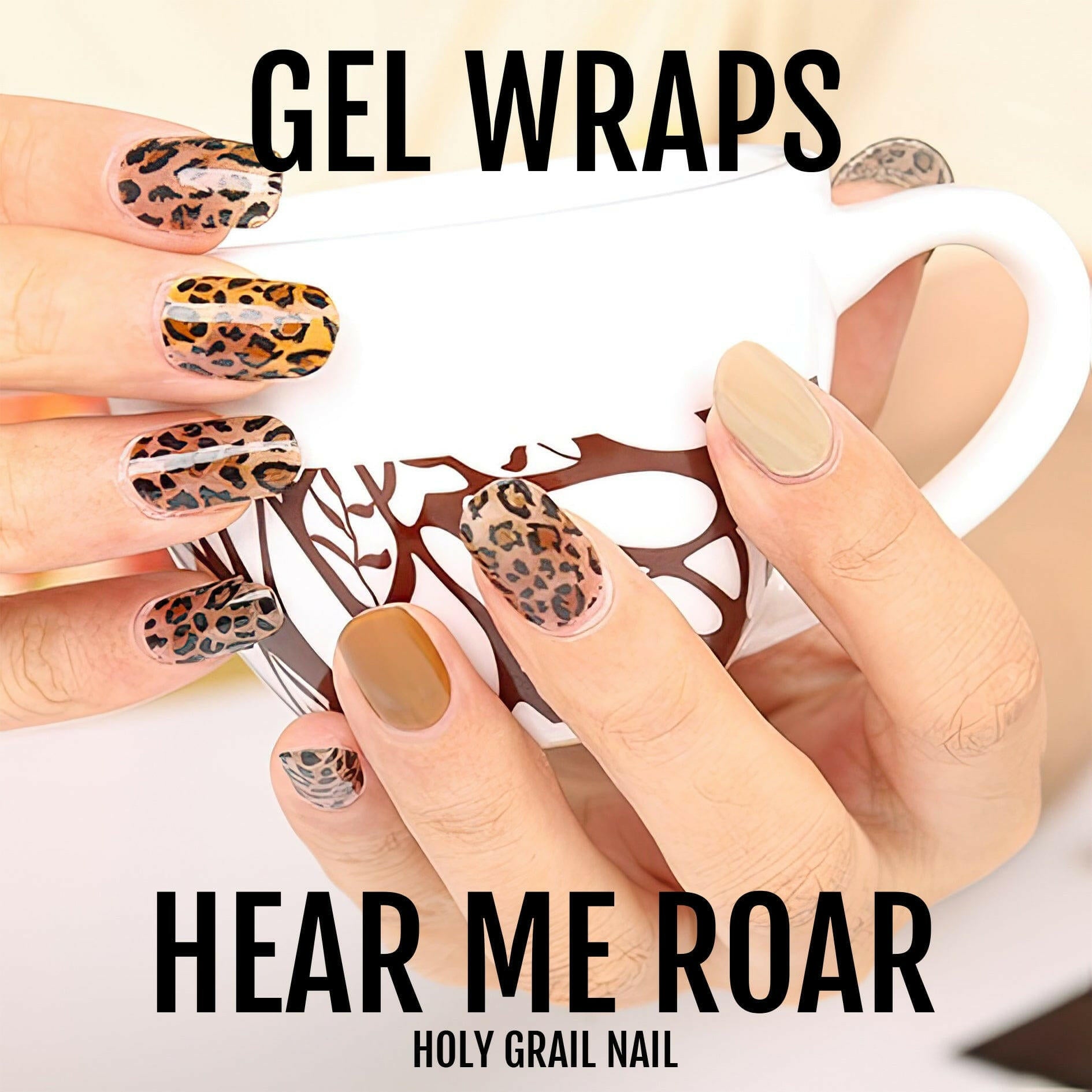 Leopard print gel nail wraps on hand showing brown and burnt orange animal print designs
