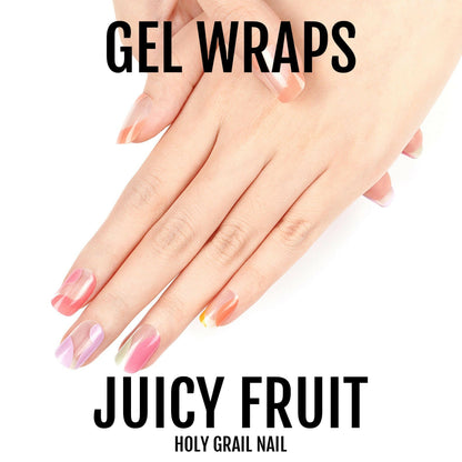Hands displaying colourful translucent gel nail wraps in pastel rainbow gradient shades