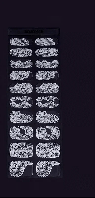 White lace gel nail wraps sheet showing intricate floral pattern designs for manicures