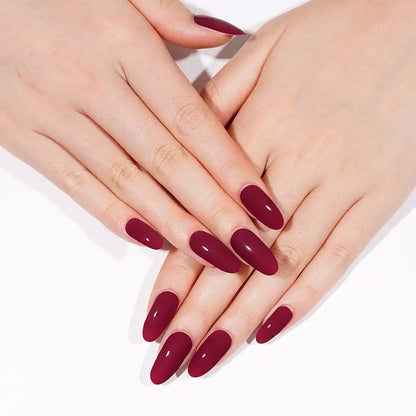 Deep red gel nail wraps displaying glossy burgundy at-home manicure finish