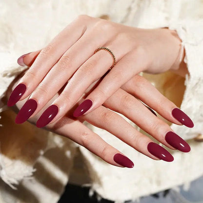 Rich wine red gel nail wraps showing sophisticated burgundy manicure on hands