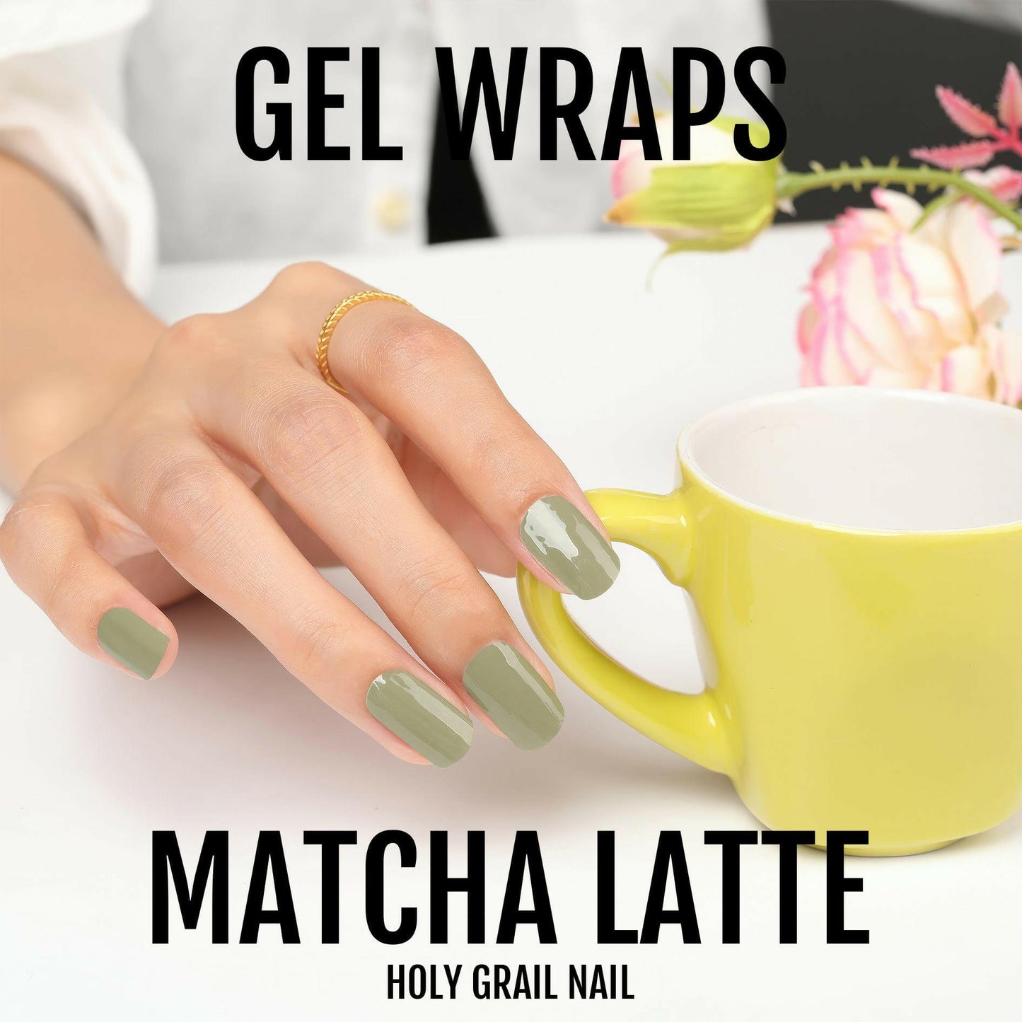 Olive green gel nail wraps on hand holding yellow mug with flowers